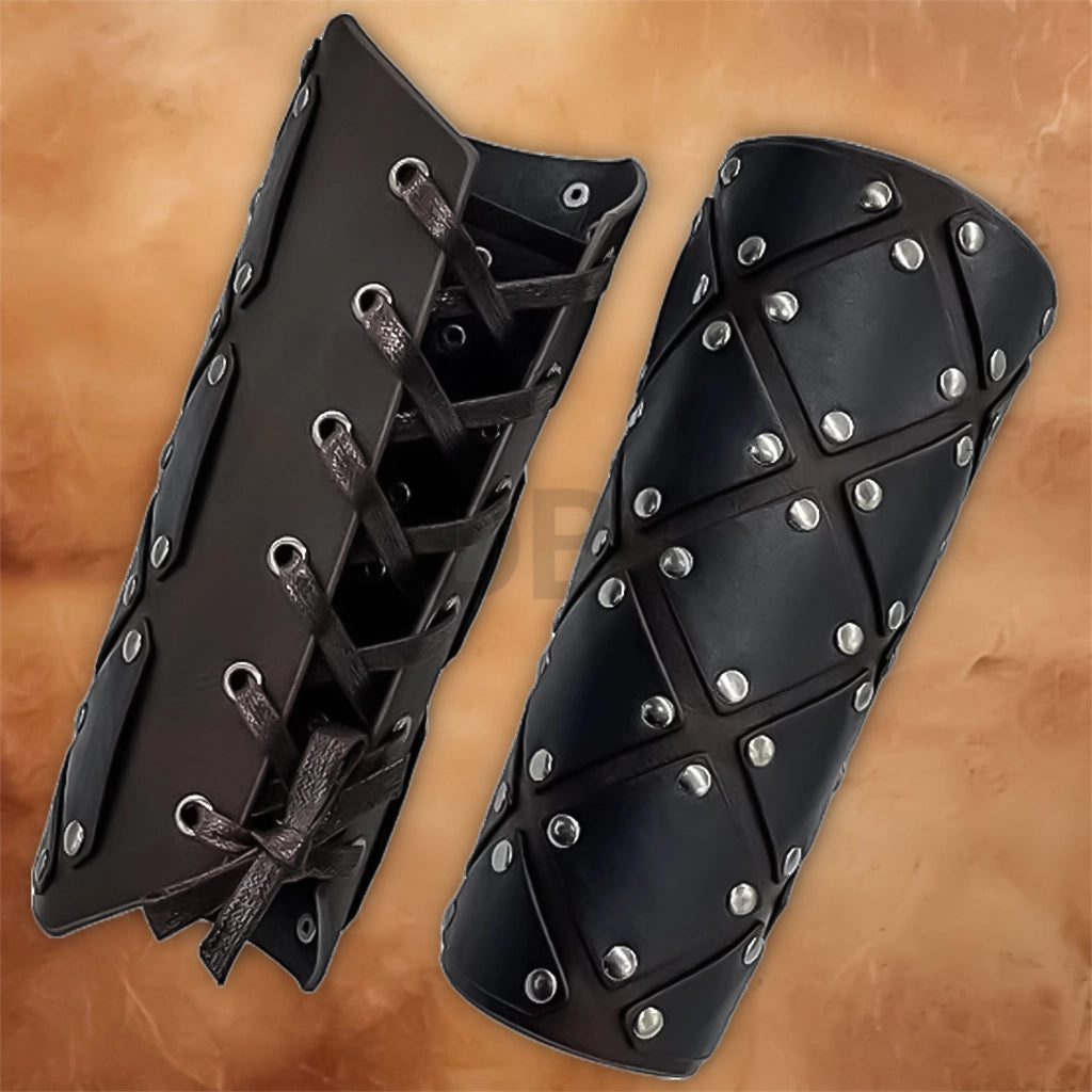Pair of Medieval Faux Leather Arm Bracers featuring black leather panels, silver rivets and adjustable lace-up straps for a Renaissance knight costume.