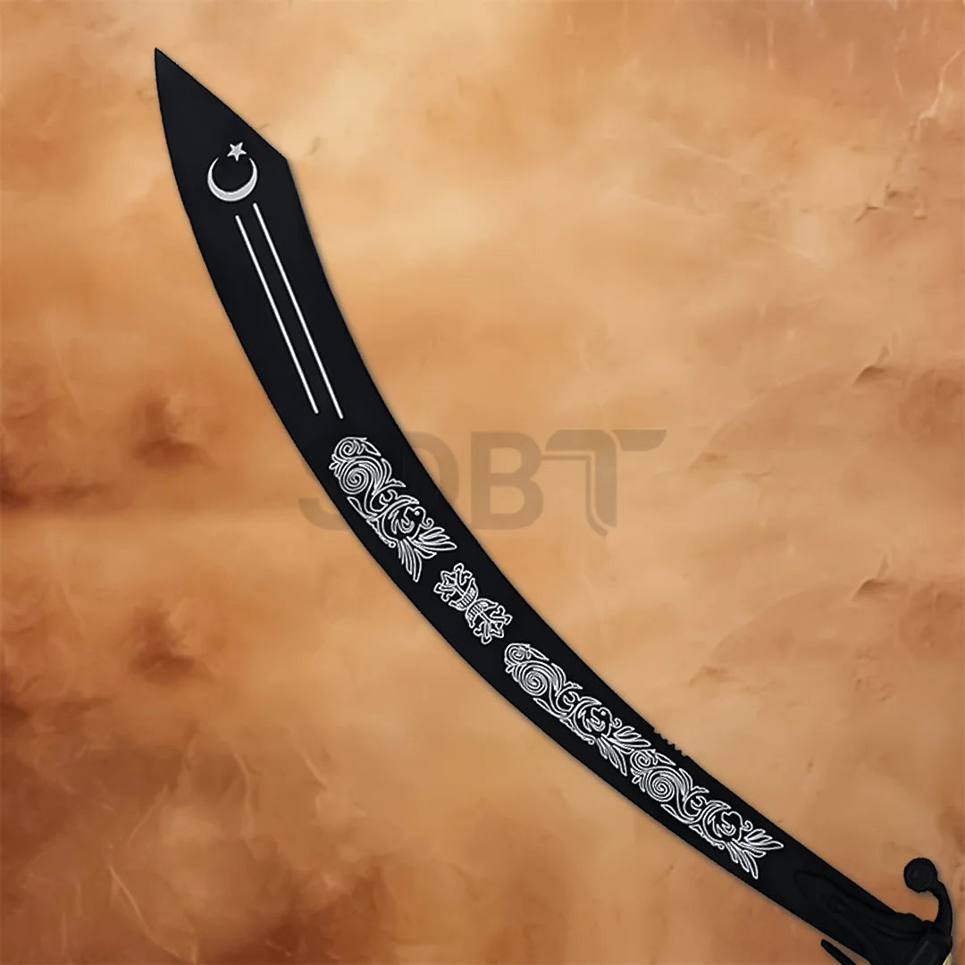 Close-up of black Arabian dragon scimitar showing floral engravings, crescent moon design and curved blade.