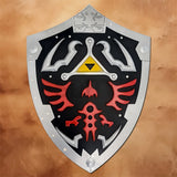 Front view of the Black Link Hylian Shield Replica from The Legend of Zelda featuring the Triforce emblem, red Hylian crest, black face, and silver border for cosplay and display.