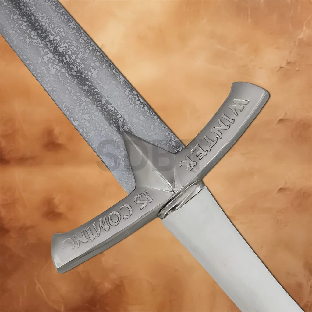 Detailed view of the Eddard Stark Ice Sword Replica showcasing the engraved crossguard with 'Winter Is Coming' lettering and premium medieval styling.