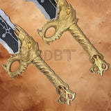 Detailed close-up of the gold dragon guard and engraved handle on the God of War Blades of Chaos Gold Finished replica.