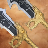 Close-up of the gold-finished handle and decorative pommel of the God of War Blades of Chaos replica showcasing intricate craftsmanship.
