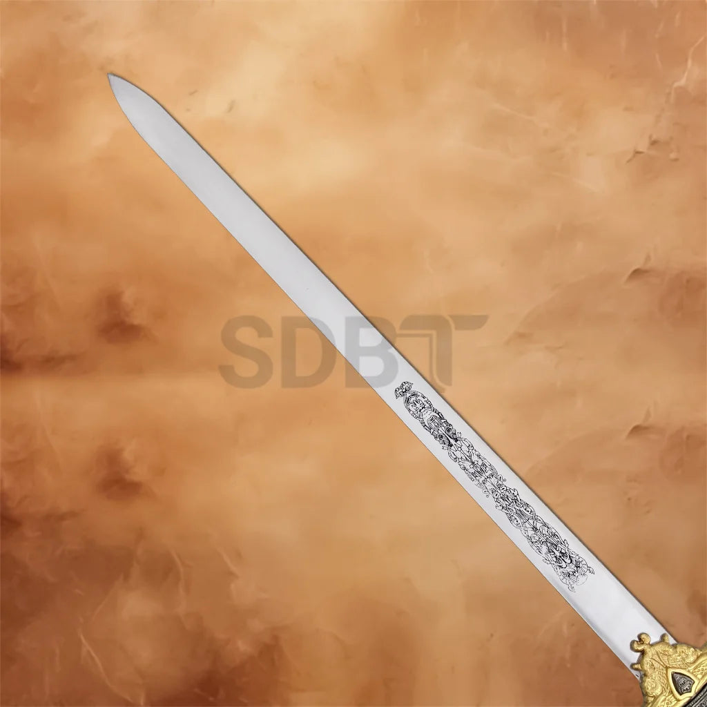 Full view of King Arthur's Excalibur Sword in the Stone Collectors Replica featuring an engraved stainless steel blade and ornate gold crossguard.