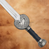 Detailed close-up of the ornate hilt on the King Theoden Herugrim Sword Replica featuring engraved guard and black grip.