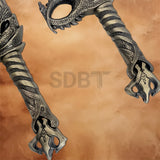 Detailed view of the Kratos Blades of Chaos replica grip and pommel with textured handle and ornate dragon-inspired craftsmanship.