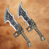 Twin Kratos Blades of Chaos replicas from God of War showcasing engraved silver blades and dragon-themed handles.