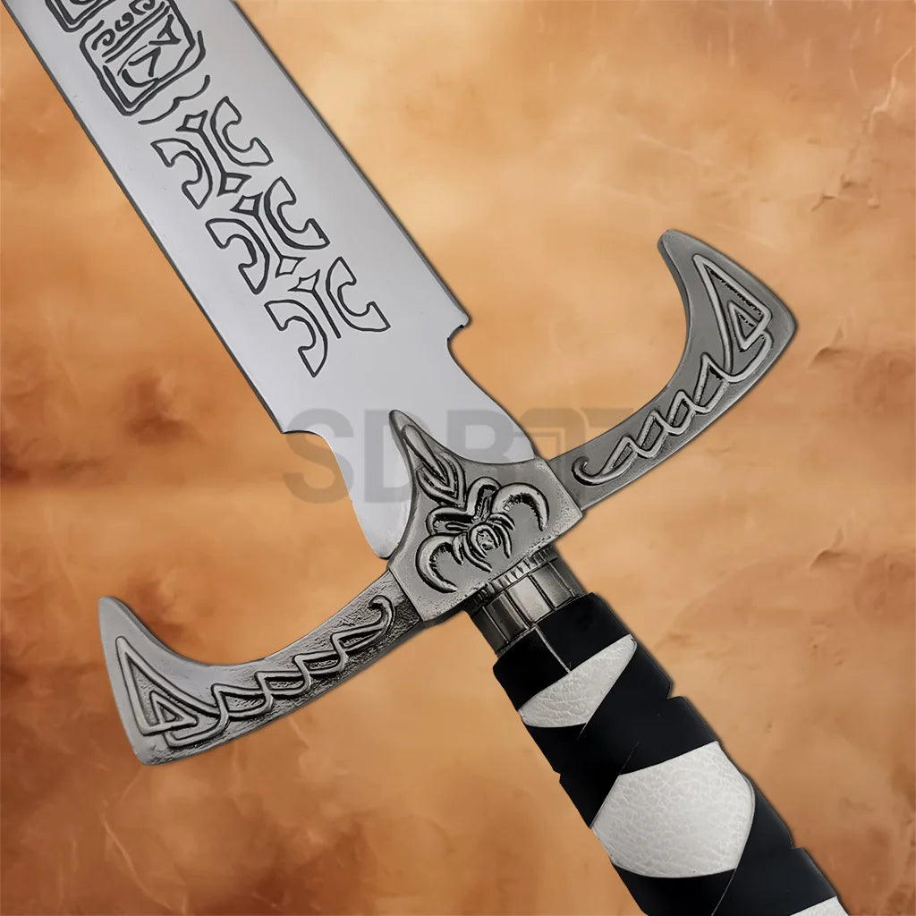 Close-up of the Legend of the Seeker Sword of Truth Replica crossguard with engraved fantasy details and wrapped handle.