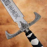 Close-up of the Legend of the Seeker Sword of Truth Replica crossguard with engraved fantasy details and wrapped handle.