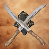 Legolas Fighting Daggers Replica Set displayed with an Elven-style wall plaque, inspired by The Lord of the Rings and perfect for fantasy collectors and home display.