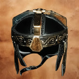 Front view of the Lord of the Rings Gimli Helmet replica featuring a black and antique gold finish with authentic Dwarven engravings and detailed craftsmanship.
