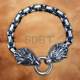 Angled view of the Men's Wolf Chain Bracelet featuring detailed Viking Norse wolf heads and polished stainless steel.