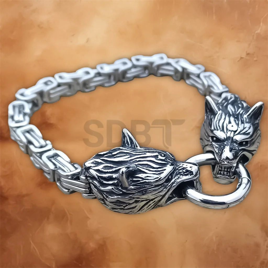 Detailed close-up of the wolf head links on the Men's Viking Norse stainless steel chain bracelet with an antique finish.