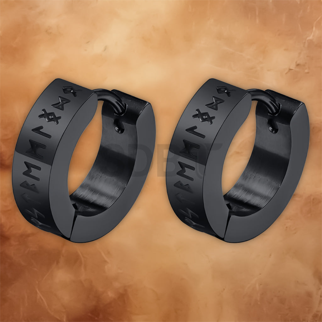 Angled view of Viking hoop earrings featuring engraved Norse runes and a polished stainless steel finish.