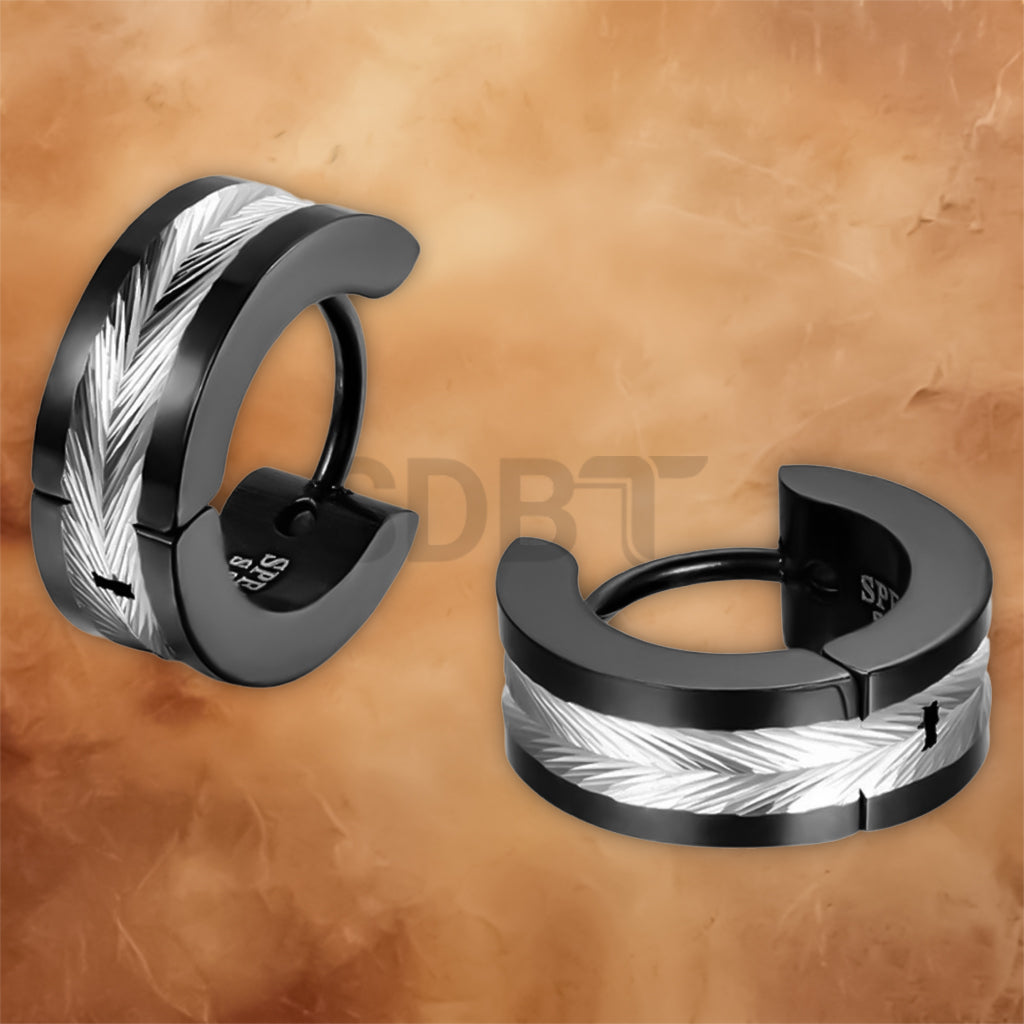 Side profile of stainless steel Viking hoop earrings featuring engraved Norse runes and a secure hinged clasp.