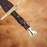 Close-up of Percy Jackson Riptide sword replica handle and gold-tone guard