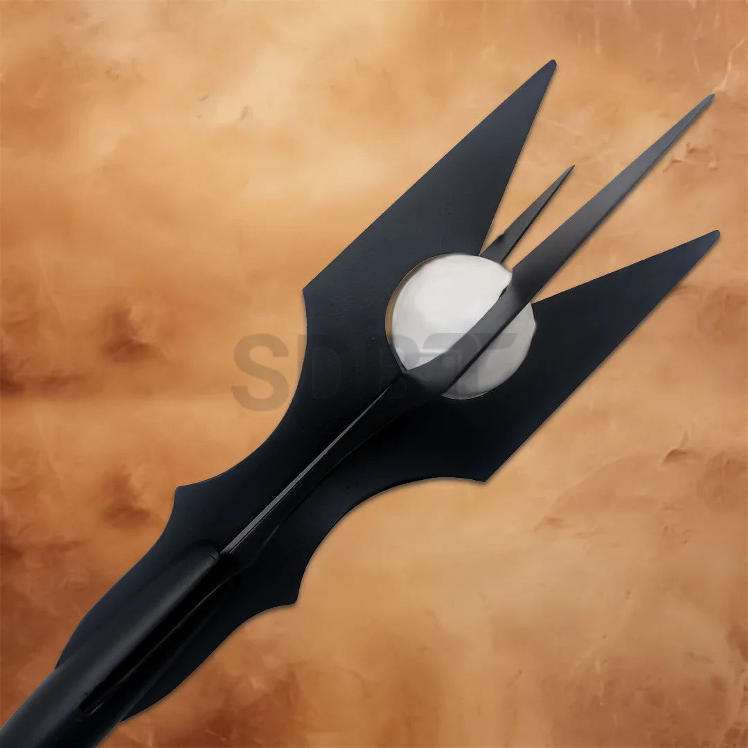 Close-up of the Black Wizard Staff of Saruman Replica showcasing the spiked crown surrounding a white orb with detailed Lord of the Rings craftsmanship.
