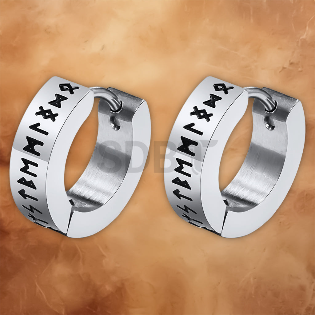 Close-up of Viking hoop earrings showcasing detailed Norse rune engravings and durable stainless steel craftsmanship.